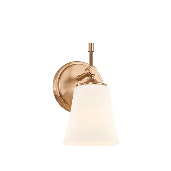 Transitional-to-modern wall sconce that blends classic proportions with clean, contemporary detailing, Mounts facing upward or downward to suit different lighting needs and design preferences, Round backplate with stepped detailing adds depth and architectural interest, Finished in brushed brass for a refined, high-end look that pairs beautifully with a wide range of color palettes, Slim cylindrical arm connects to a refined pivot-style joint beneath the shade, introducing a subtle, jewelry-like detail, Short vertical decorative stem drops below the joint, adding visual balance and a touch of understated tradition, Gently flared opal artisan glass shade widens at the top and tapers toward the metal fitter for a graceful, tailored profile, Opal artisan glass softly diffuses light to create an even, warm glow without harsh glare, Uses a standard E26 base socket for easy lamping flexibility (bulb not included), Versatile design works beautifully in bathrooms, hallways, bedrooms, living spaces, and bedside applications, Timeless aesthetic complements today's furnishings and trends while remaining suitable for residential, commercial, and hospitality interiors. Collection: Fusion Finish: Brushed Brass Glass: Opal Glass Width: 5.25" Height: 9.25" Extension from Wall: 6.25" Canopy: 5.25" Dia x 0.75" Proj. Number of Bulbs: 1 Maximum Wattage: 100.00 W Bulb Base: E26 Voltage: 120.00 V Safety Rating: Damp