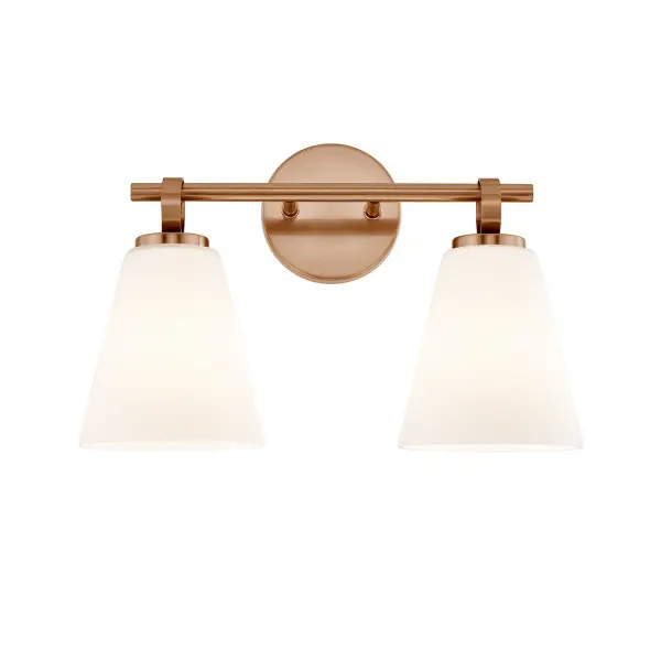 Contemporary 2-light bath vanity sconce from the Bolzano Family with a clean, architectural presence that feels both refined and timeless, Can be mounted upward or downward, offering flexibility to tailor light direction and visual impact based on the space and mirror height, Features two gently tapered opal glass shades with a soft conical profile that avoids sharp angles, creating an elegant and calming silhouette, When illuminated, the opal artisan glass diffuses light evenly, producing a warm, flattering glow without hotspots or glare, ideal for daily grooming and ambient lighting, When mounted downward, the distinctive ring detail appears to suspend each shade from the horizontal bar, introducing a jewelry-like accent that adds depth, craftsmanship, and subtle visual interest without overpowering the design, Brushed brass finish delivers a warm, understated sophistication that pairs effortlessly with modern, transitional, and contemporary interiors, Horizontal bar design keeps the fixture visually balanced and well-proportioned, making it especially suitable for standard and double-sink vanities, Round backplate provides a clean, grounded connection to the wall while maintaining a tidy, architectural profile, Balanced scale feels substantial enough to make a statement yet restrained enough for repeated use in pairs or multiples, Ideal for bathrooms, powder rooms, and hospitality settings where soft, even illumination and refined detailing are essential, Requires (2) medium base E26 bulbs (not included), compatible with dimmers for adjustable ambiance, ETL listed and suitable for damp locations, combining everyday practicality with elevated design appeal, Collection: Fusion Finish: Brushed Brass Glass: Opal Glass Width: 16.00" Height: 10.50" Extension from Wall: 6.50" Canopy: 4.75" Dia x 0.75" Proj. Number of Bulbs: 2 Maximum Wattage: 100.00 W Bulb Base: E26 Voltage: 120.00 V Safety Rating: Damp