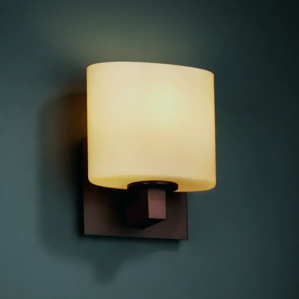 Modular ADA 1-Light Bracket Oval Shade Collection: Fusion Finish: Dark Bronze Glass: Artisan Glass Width: 6.50" Height: 7.75" Extension from Wall: 4.00" Top to Outlet: 5.25" Number of Bulbs: 1 Maximum Wattage: 100.00 W Bulb Type: A19 Safety Listing: Damp Safety Rating: Damp ADA