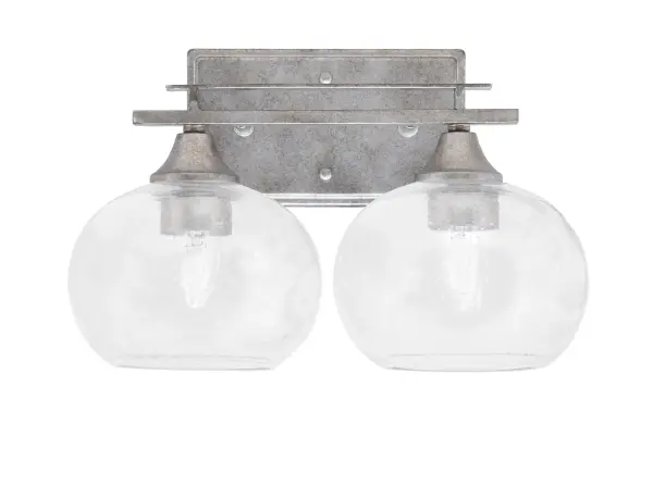 The Uptowne 2-Light Bath Bar combines aged silver finish with distinctive bubble glass shades for a sophisticated vintage aesthetic. Perfect for bathrooms needing both style and practical illumination.