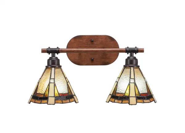 The Blacksmith 2-Light Bath Bar combines painted wood-look metal with dark granite finish and handcrafted Zion art glass shades. Perfect for adding rustic charm to bathrooms, this versatile fixture can mount up or down and accommodates LED bulbs.