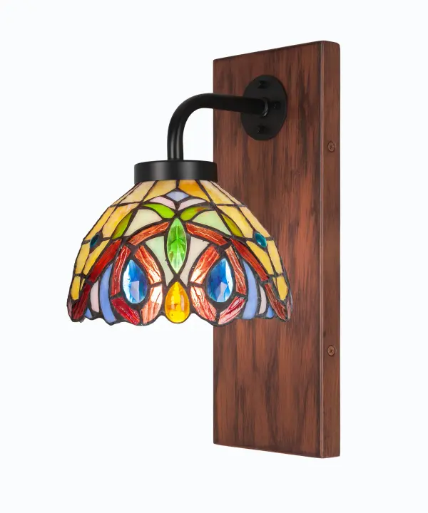 The Oxbridge Wall Sconce blends contemporary design with rustic charm through its matte black and painted wood-look metal finish. The 7-inch Lynx art glass shade provides warm, diffused lighting perfect for intimate spaces.