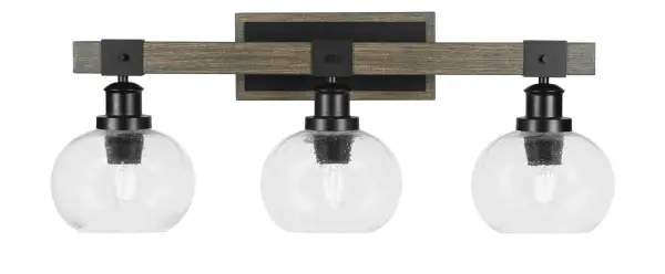 The Tacoma 3-Light Bath Bar combines matte black metal with distressed wood-look accents and clear bubble glass shades for a perfect blend of farmhouse charm and industrial edge. Ideal for bathrooms seeking character and warmth.