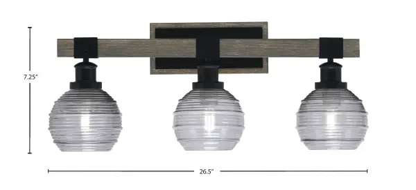 The Tacoma 3-Light Bath Bar blends industrial matte black with distressed wood-look metal for a rustic-modern aesthetic. Smoke ribbed glass shades provide soft, diffused lighting ideal for bathroom vanities. - alternate view