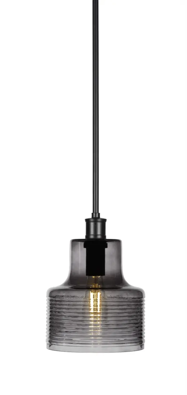 The Aurora pendant delivers contemporary style in a compact 7.5" format. Its matte black finish and smokey glass shade create sophisticated, diffused lighting perfect for intimate spaces and task areas.
