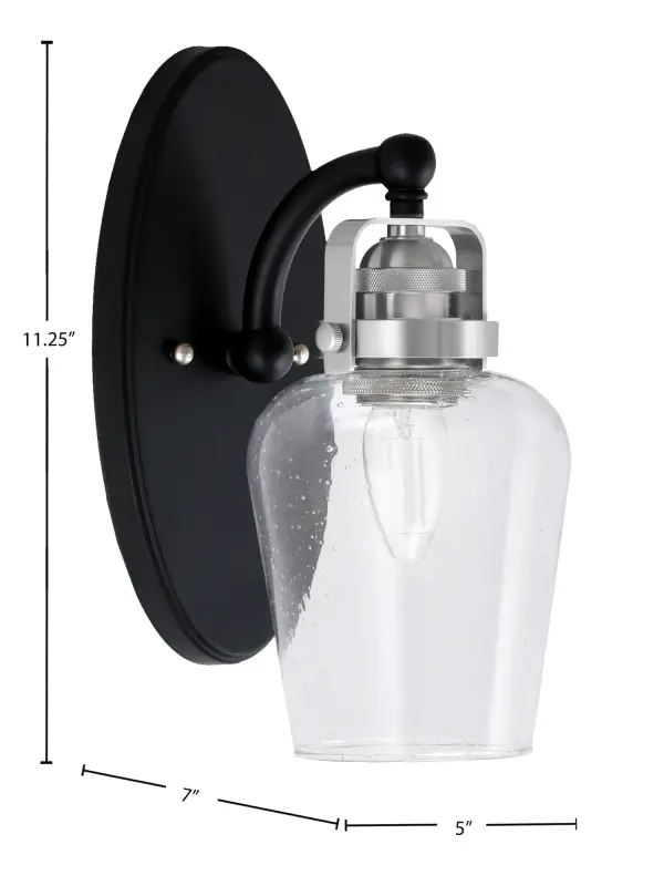 The Easton Wall Sconce combines modern matte black with brushed nickel accents for a sophisticated two-tone look. Its 5-inch clear bubble glass shade creates visual interest while diffusing light beautifully, making it perfect for hallways, entryways, and living spaces. - alternate view