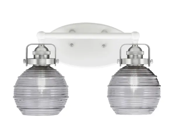 The Easton 2-Light Bath Bar combines white and brushed nickel finishes for a fresh, transitional look. Smoke ribbed glass shades diffuse light beautifully while the reversible mount allows up or down installation for design flexibility.