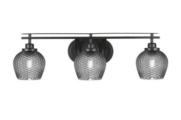 The Odyssey 3-Light Bath Bar combines sleek matte black finish with smoke-textured glass shades for sophisticated bathroom lighting. Versatile up or down mounting and dimmable capability make it adaptable to any space.
