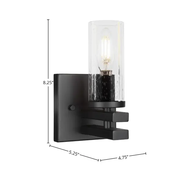 The Belmont Wall Sconce combines modern matte black styling with unique clear bubble glass for a sophisticated look. Its compact 8.25" height makes it ideal for smaller spaces while the upward light direction creates ambient illumination. - alternate view