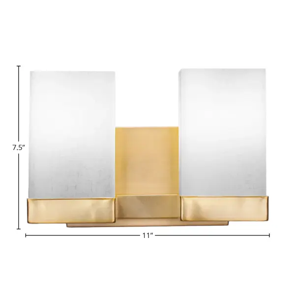 The Nouvelle 2 Light Bath Bar combines modern elegance with practical functionality. Its New Age Brass finish adds warmth and sophistication, while the square white muslin glass shades provide soft, flattering illumination perfect for bathroom vanities. - alternate view