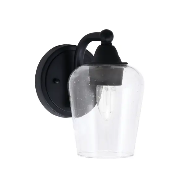 The Paramount Wall Sconce combines matte black finish with unique clear bubble glass for a sophisticated lighting solution. Its compact 5-inch design and up/down mounting flexibility make it ideal for various spaces.
