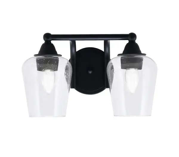 The Paramount 2-Light Bath Bar combines sleek matte black finish with eye-catching clear bubble glass shades. Perfect for modern bathrooms, this versatile fixture mounts up or down and accommodates LED bulbs for energy efficiency.