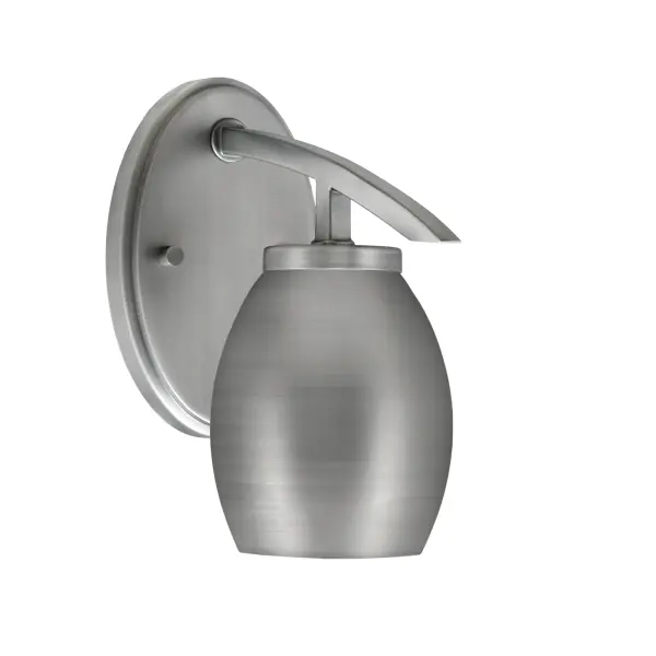 The Kurve Downlight Wall Sconce combines modern design with practical functionality. Its graphite finish and oval metal shade create warm, directional lighting perfect for hallways and entryways.