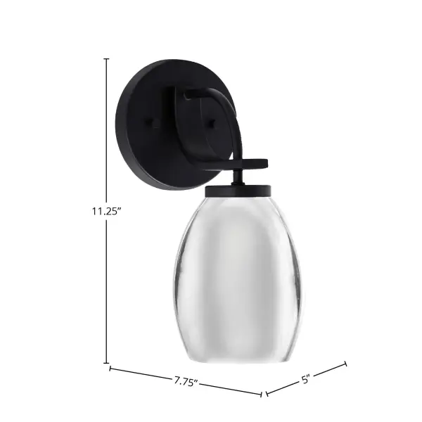 The Cavella Wall Sconce combines a sophisticated matte black finish with a striking chrome oval shade, creating a modern aesthetic perfect for contemporary spaces. Its compact 5-inch width and versatile up or down mounting make it ideal for hallways, bathrooms, and accent lighting applications. - alternate view