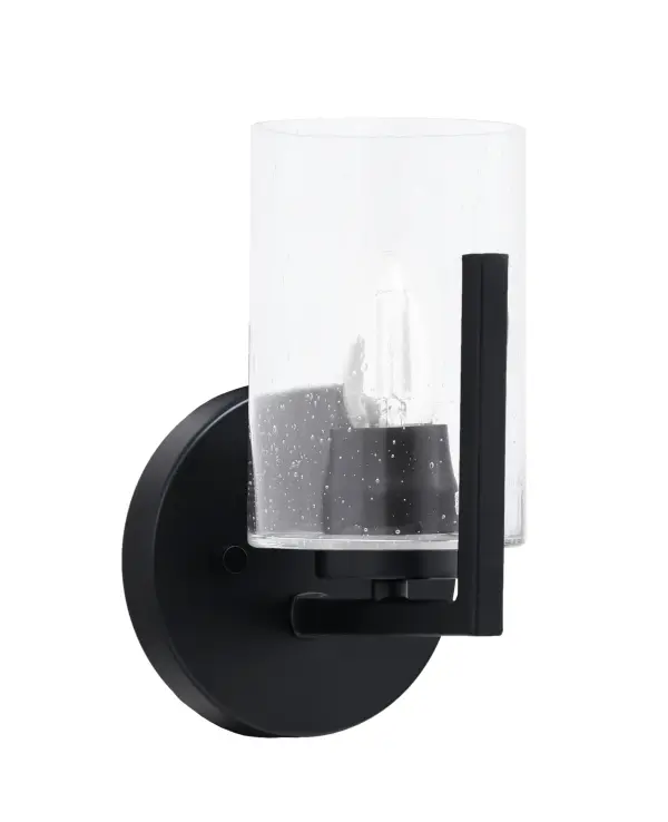 The Atlas Wall Sconce combines modern matte black finish with charming clear bubble glass for a sophisticated look. Its compact 5-inch profile and versatile up/down mounting make it ideal for bathrooms, hallways, and accent lighting.