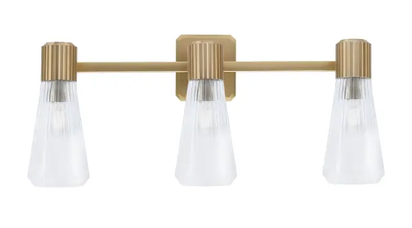 The Everleigh 3 Light Bath Bar combines sleek New Age Brass finish with textured ribbed glass shades for sophisticated bathroom lighting. Its 25-inch span provides even illumination perfect for vanity tasks.