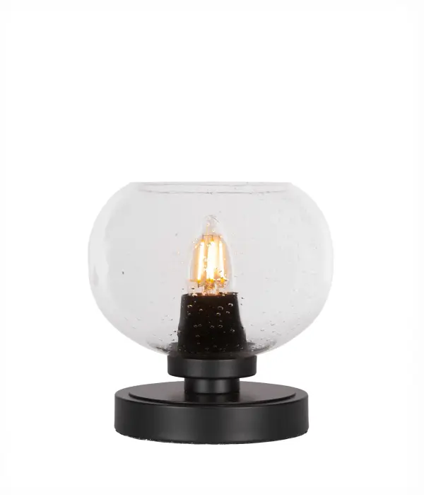 The Luna Accent Lamp combines contemporary matte black styling with unique clear bubble glass for an airy, modern aesthetic. Compact at 7" height, it's perfect for adding ambient lighting to intimate spaces.
