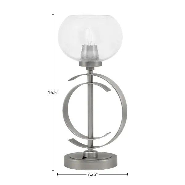 This contemporary accent lamp combines a sleek graphite finish with a unique 7-inch clear bubble glass shade, creating visual interest and warm ambient lighting. Compact at 16.5" tall, it's perfect for adding character to side tables and desks. - alternate view