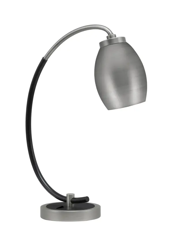 This stylish desk lamp combines graphite and matte black finishes with a distinctive oval metal shade, delivering focused task lighting perfect for workspaces. Compact yet impactful design with convenient on-base rocker switch.
