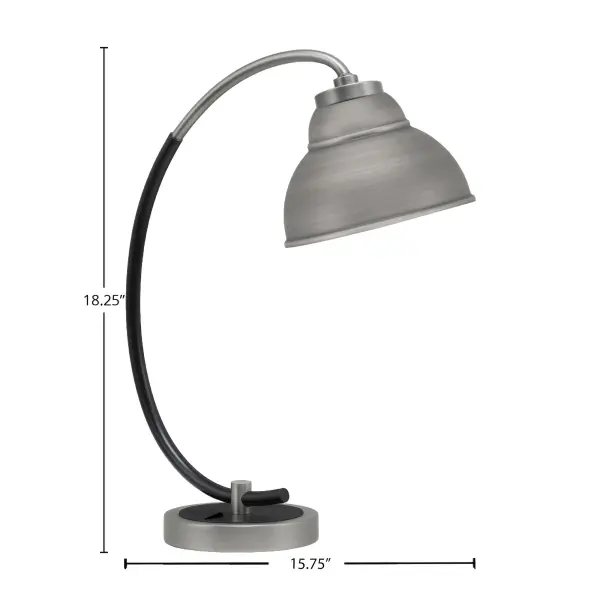 This sleek desk lamp combines industrial style with modern functionality. The unique 7" double bubble metal shade in graphite finish paired with matte black accents creates a striking visual statement while providing focused task lighting for reading and working. - alternate view