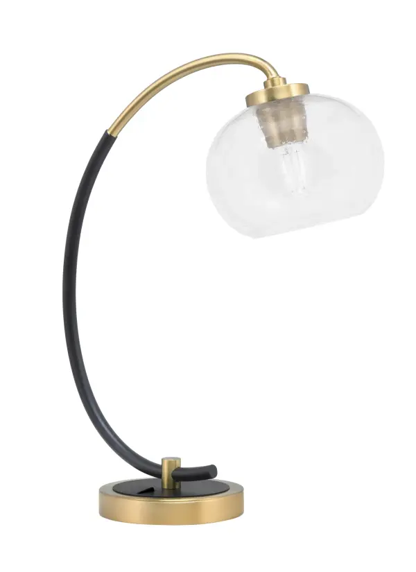 This contemporary desk lamp combines a sleek matte black base with new age brass accents and a unique 7" clear bubble glass shade. Perfect for task lighting in home offices or bedrooms, it provides soft, even illumination while adding a stylish focal point to any workspace.