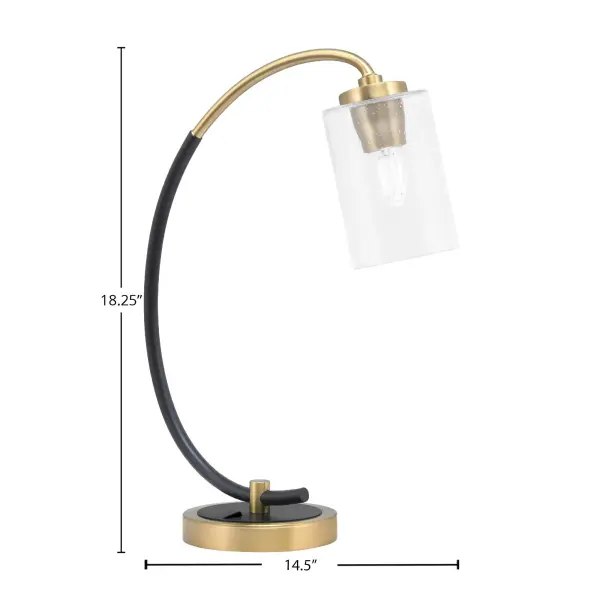 This contemporary desk lamp combines matte black and brass finishes with a unique 4" clear bubble glass shade. Perfect for task lighting in home offices or bedrooms, it offers adjustable illumination with a 6-foot cord and convenient base rocker switch. - alternate view