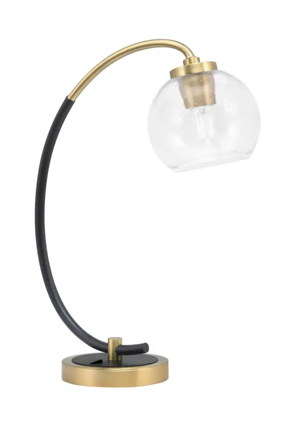 This contemporary desk lamp combines a striking matte black base with new age brass accents and a distinctive 5.75" clear bubble glass shade. At 18.25" tall, it provides focused task lighting while adding visual interest to any workspace or bedroom.