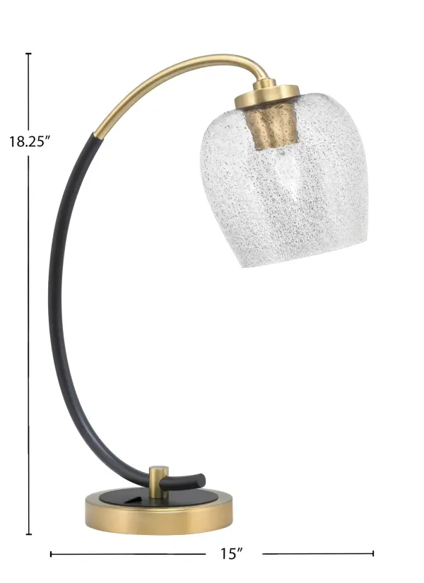 This striking desk lamp combines matte black and brass finishes with a unique 6" smoke bubble glass shade. Perfect for modern workspaces, it provides focused task lighting while serving as an elegant decorative accent. - alternate view