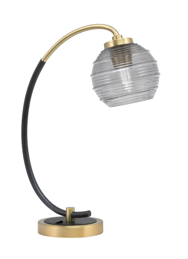 This striking desk lamp combines matte black and vintage brass finishes with a smoke ribbed glass shade for sophisticated task lighting. Perfect for home offices and studies, it delivers both style and function.