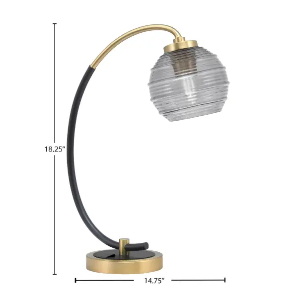This striking desk lamp combines matte black and vintage brass finishes with a smoke ribbed glass shade for sophisticated task lighting. Perfect for home offices and studies, it delivers both style and function. - alternate view