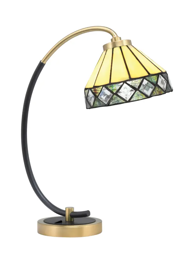 This contemporary desk lamp combines a sleek matte black base with new age brass accents and a unique 7" diamond peak art glass shade. Perfect for home offices and study spaces, it delivers both functional task lighting and decorative appeal.