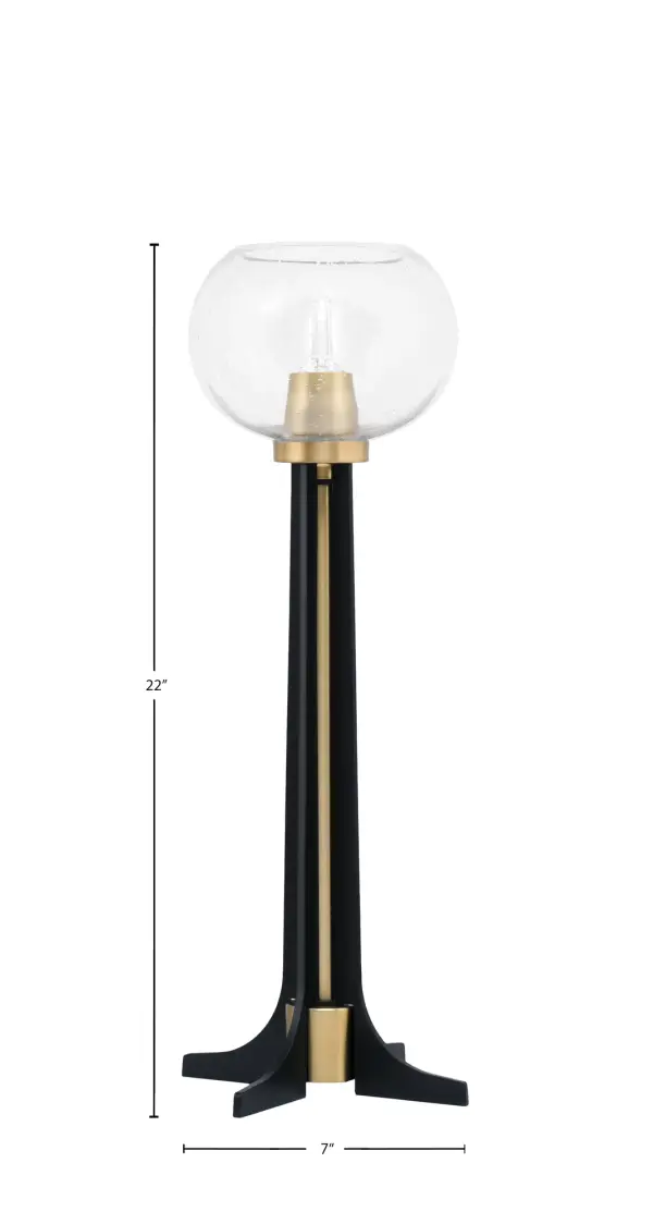 This striking accent lamp combines contemporary style with industrial flair through its matte black and brass finish. The 7" clear bubble glass shade creates visual interest while providing warm ambient lighting for any space. - alternate view