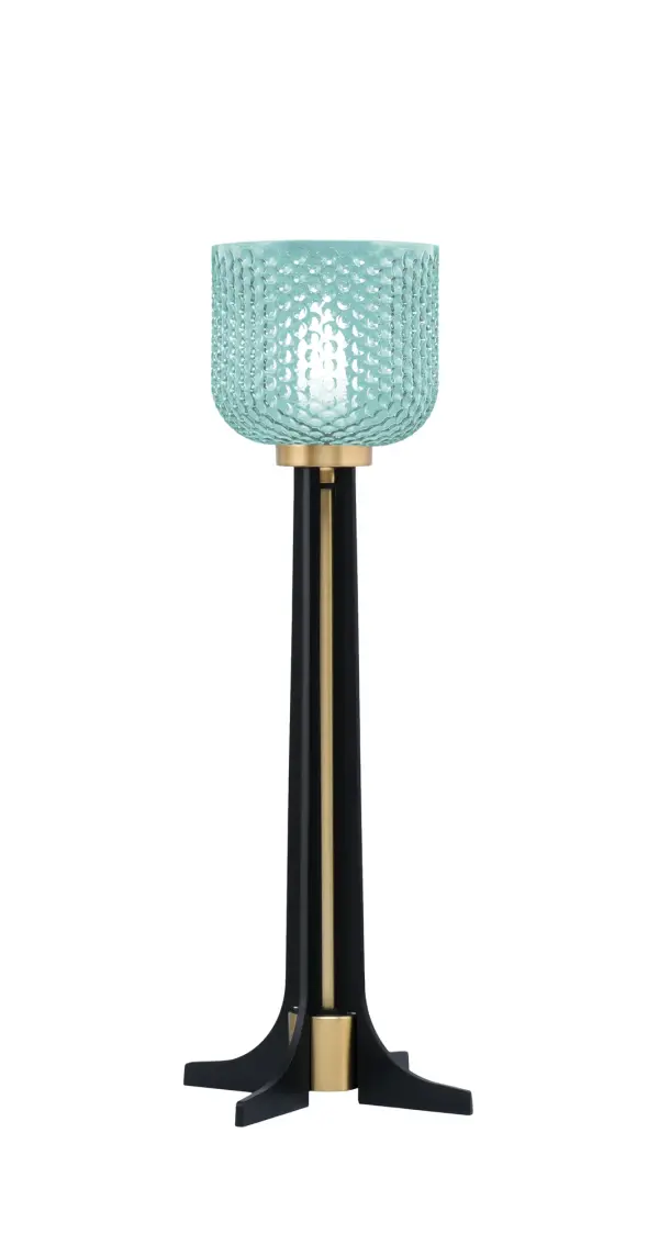 This contemporary accent lamp combines matte black and new age brass finishes with a unique 6" turquoise textured glass shade. At 22.25" tall, it's perfectly sized for side tables and nightstands, offering both functional lighting and decorative appeal.
