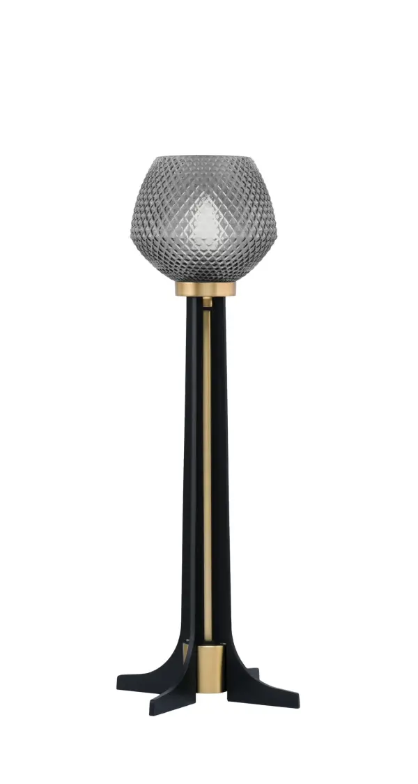 This contemporary accent lamp combines matte black and brass finishes with smoke textured glass for sophisticated style. At 22" tall with an 8.5" base, it's perfectly sized for nightstands, end tables, or desks. The rocker switch and 6-foot cord provide convenient operation.