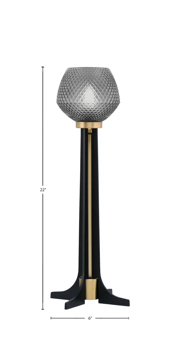 This contemporary accent lamp combines matte black and brass finishes with smoke textured glass for sophisticated style. At 22" tall with an 8.5" base, it's perfectly sized for nightstands, end tables, or desks. The rocker switch and 6-foot cord provide convenient operation. - alternate view