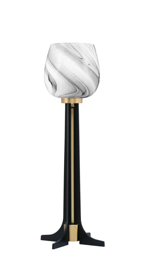 This sophisticated accent lamp combines matte black and new age brass finishes with a beautiful 6" onyx swirl glass shade. At 23" tall with an 8.5" base, it provides warm ambient lighting perfect for side tables and desks.