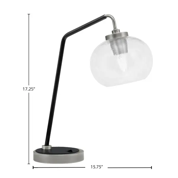 This elegant desk lamp combines modern industrial styling with functional design. The graphite and matte black finish paired with a unique 7-inch clear bubble glass shade creates visual interest while providing warm, focused task lighting. - alternate view