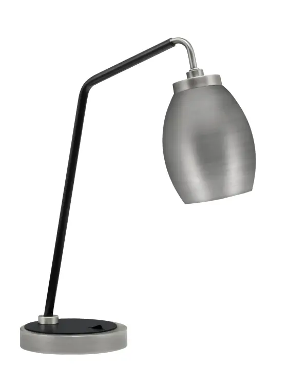 This stylish desk lamp combines graphite and matte black finishes with a unique oval metal shade for focused task lighting. Compact 15" width fits any desk while providing ambient glow for work or study sessions.