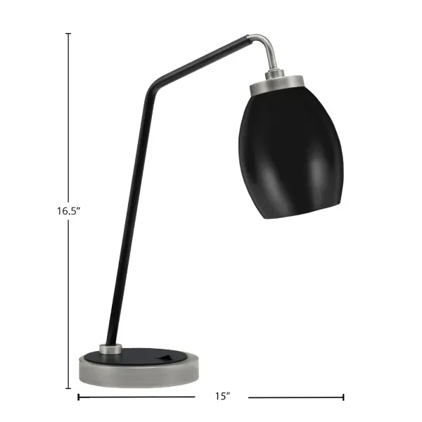 This modern desk lamp combines graphite and matte black finishes for a sophisticated industrial aesthetic. The 5" oval metal shade provides focused illumination perfect for reading and workspace tasks. - alternate view