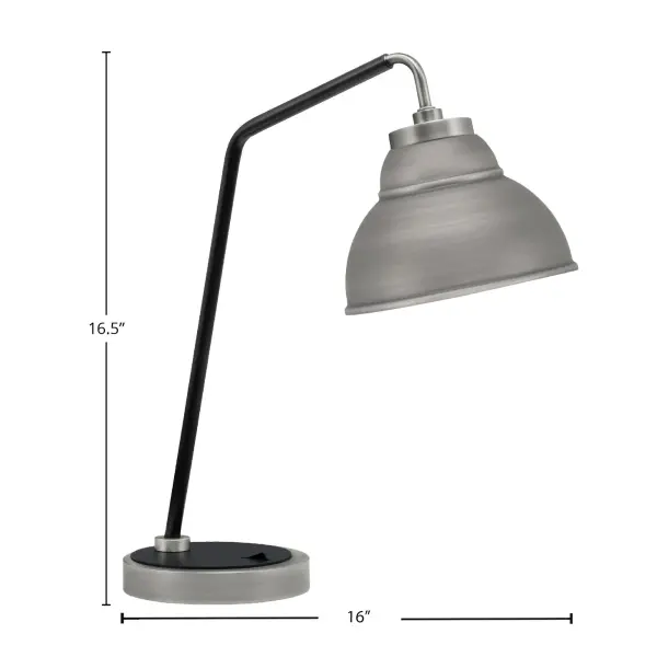 This desk lamp combines striking contemporary aesthetics with practical functionality. The unique double bubble metal shade in graphite finish paired with matte black accents creates visual interest while providing focused ambient lighting for workspaces. - alternate view