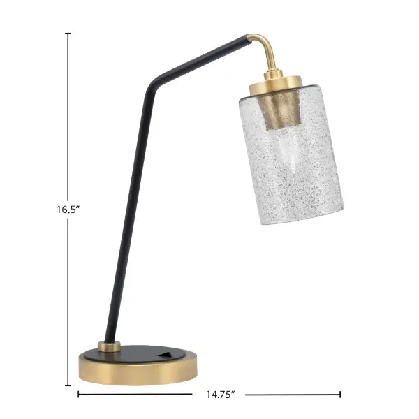 This striking desk lamp combines matte black and brass finishes with a unique 4-inch smoke bubble glass shade, delivering both task lighting and contemporary style. Perfect for modern workspaces and bedrooms. - alternate view