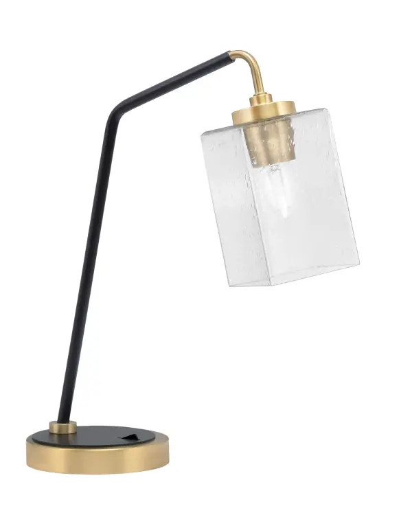 This striking desk lamp combines industrial style with modern sophistication through its two-tone matte black and brass finish. The unique 4" square bubble glass shade creates beautiful light diffusion while the compact design fits perfectly on desks and side tables.