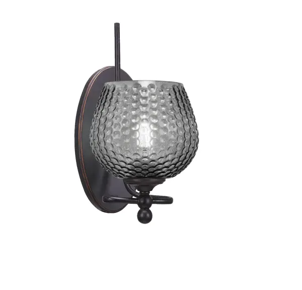 The Capri Wall Sconce combines handcrafted smoke textured glass with a dark granite finish for subtle sophistication. Its compact 6-inch width and up/down mounting flexibility make it ideal for accent or task lighting in any space.