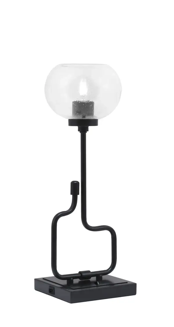 The Sandia Accent Lamp combines contemporary style with practical functionality. Its matte black finish and unique bubble glass shade create visual interest, while built-in USB ports add modern convenience for charging devices.