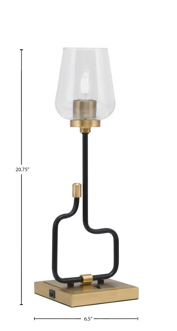 The Sandia Accent Lamp combines modern industrial style with practical functionality. Its matte black and aged brass finish creates visual interest, while the textured bubble glass shade adds character. Built-in USB ports make it perfect for bedside or desk use. - alternate view