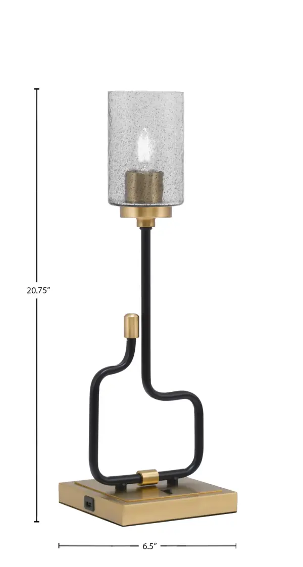 The Sandia Accent Lamp combines industrial style with modern functionality, featuring integrated USB ports for device charging. The smoke bubble glass shade creates unique light diffusion while matte black and aged brass finishes add sophisticated contrast. - alternate view