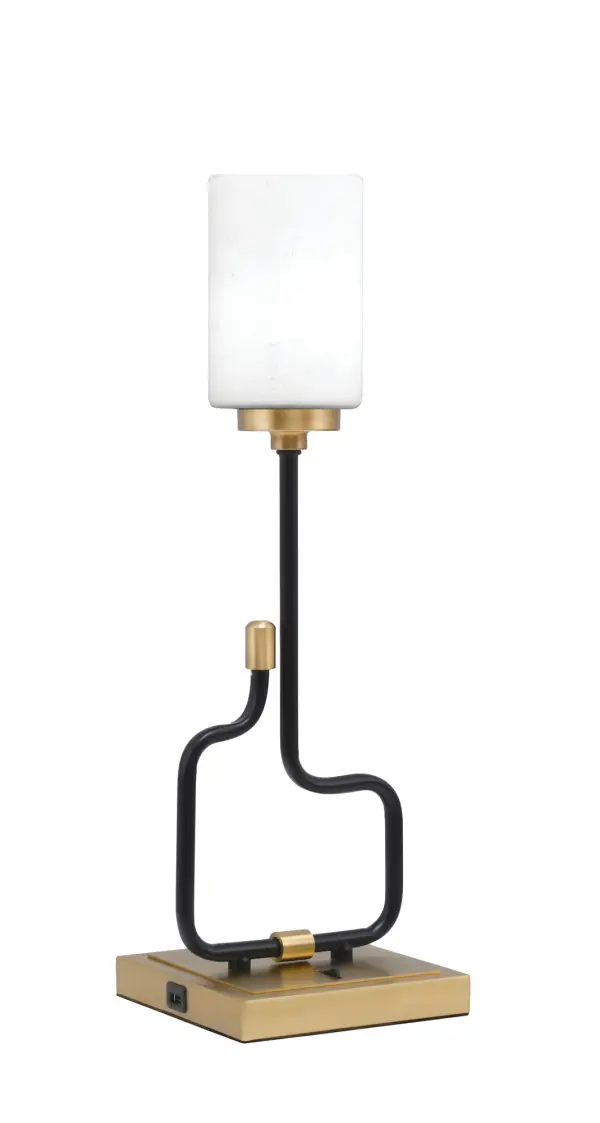 The Sandia Accent Lamp combines contemporary style with practical functionality. Its matte black and aged brass finish creates visual interest, while built-in USB ports add modern convenience for charging devices.