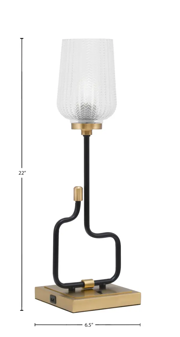 The Sandia Accent Lamp combines contemporary style with practical functionality. Its matte black and aged brass finish paired with textured glass creates visual interest, while built-in USB ports add modern convenience. - alternate view
