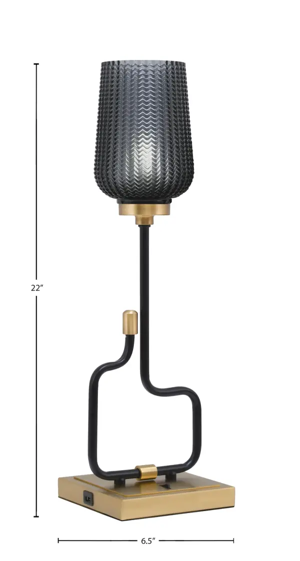 The Sandia Accent Lamp combines contemporary style with practical functionality. Featuring a sophisticated matte black and aged brass finish with smoke textured glass, it includes built-in USB ports for device charging. - alternate view