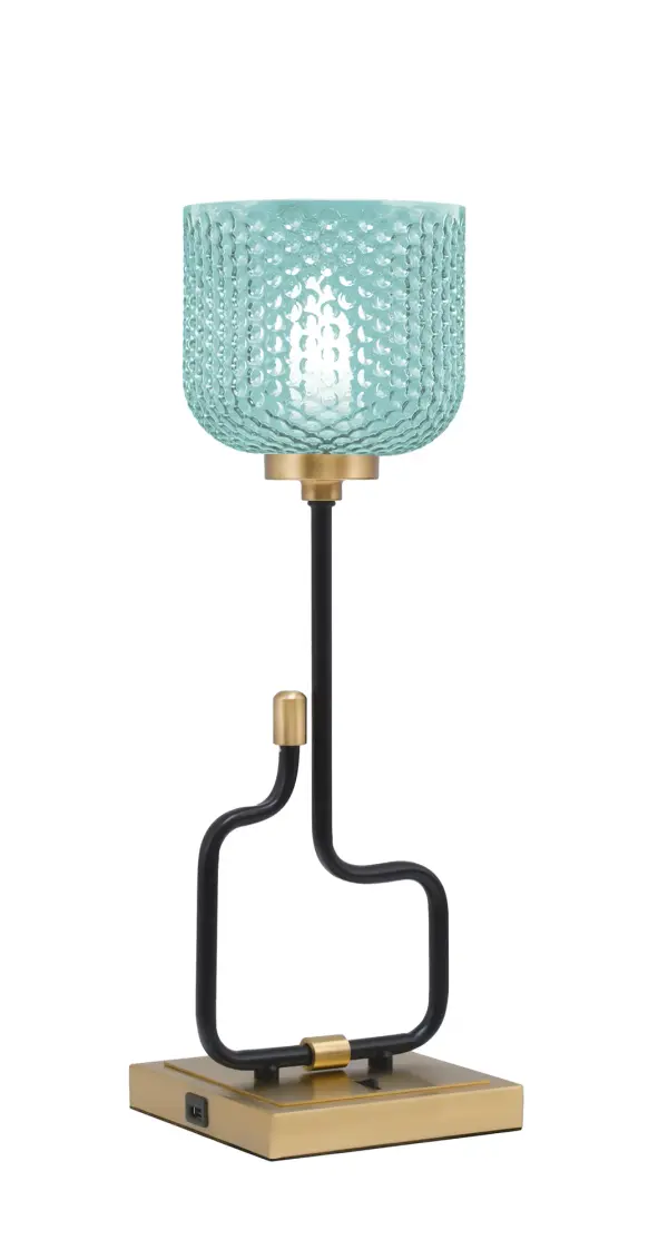 The Sandia Accent Lamp combines contemporary style with practical functionality. Its striking turquoise textured glass shade and mixed metal finish create visual interest, while built-in USB ports add modern convenience for bedside or desk use.